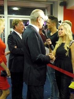 Francis being interviewed, with Rick in background