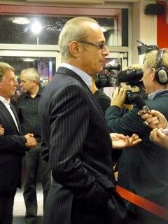 Francis being interviewed, with Rick in background